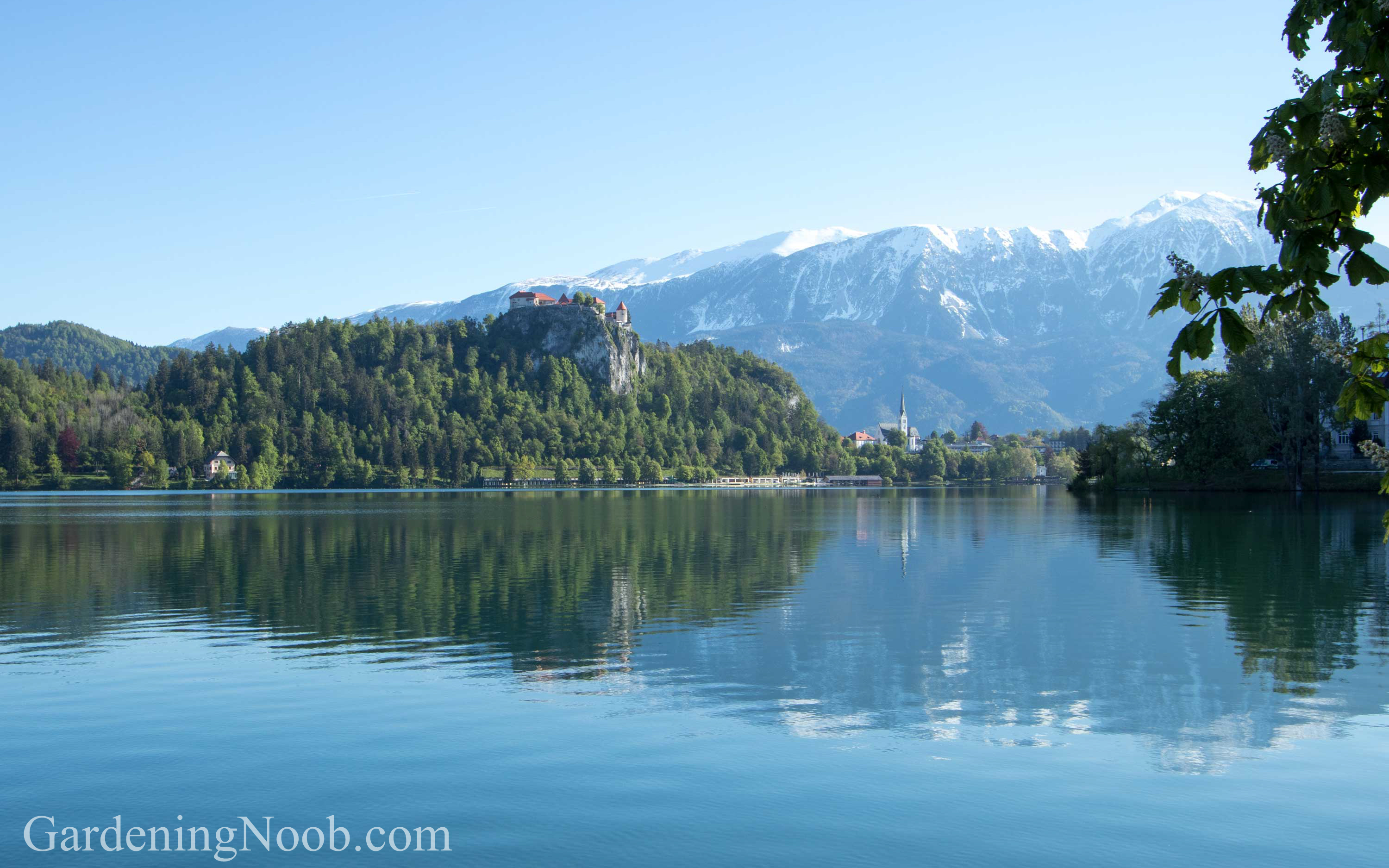 Snow covered mountain peaks in May in Bled, Slovenia.
